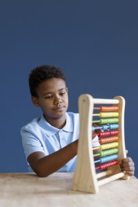 kid with abacus